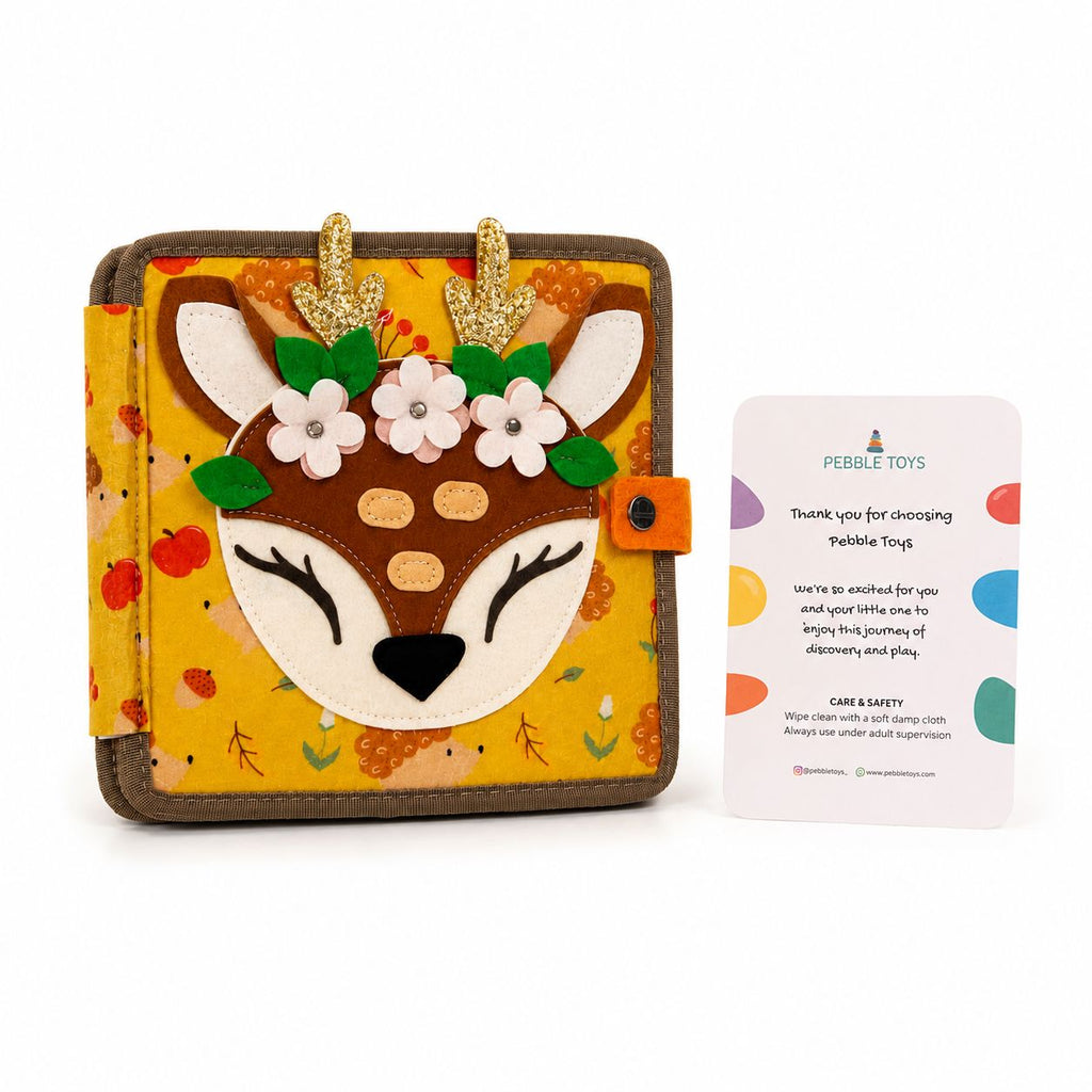 Children's book with deer design on cover and Pebble Toys card