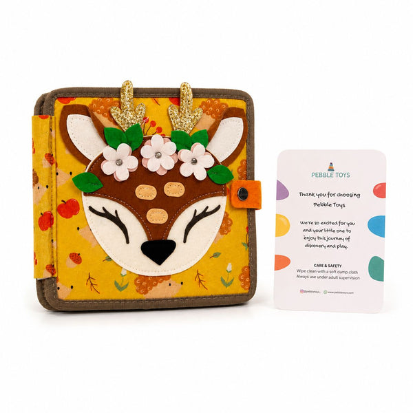 Children's book with deer design on cover and Pebble Toys card