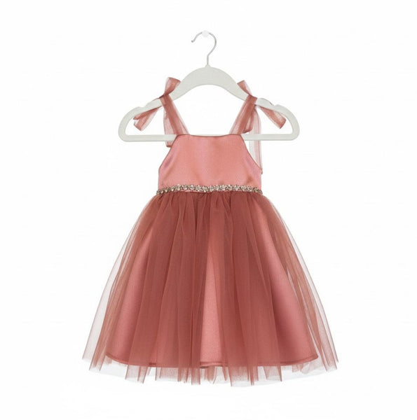 Pink dress with tulle skirt on a white hanger against a white background