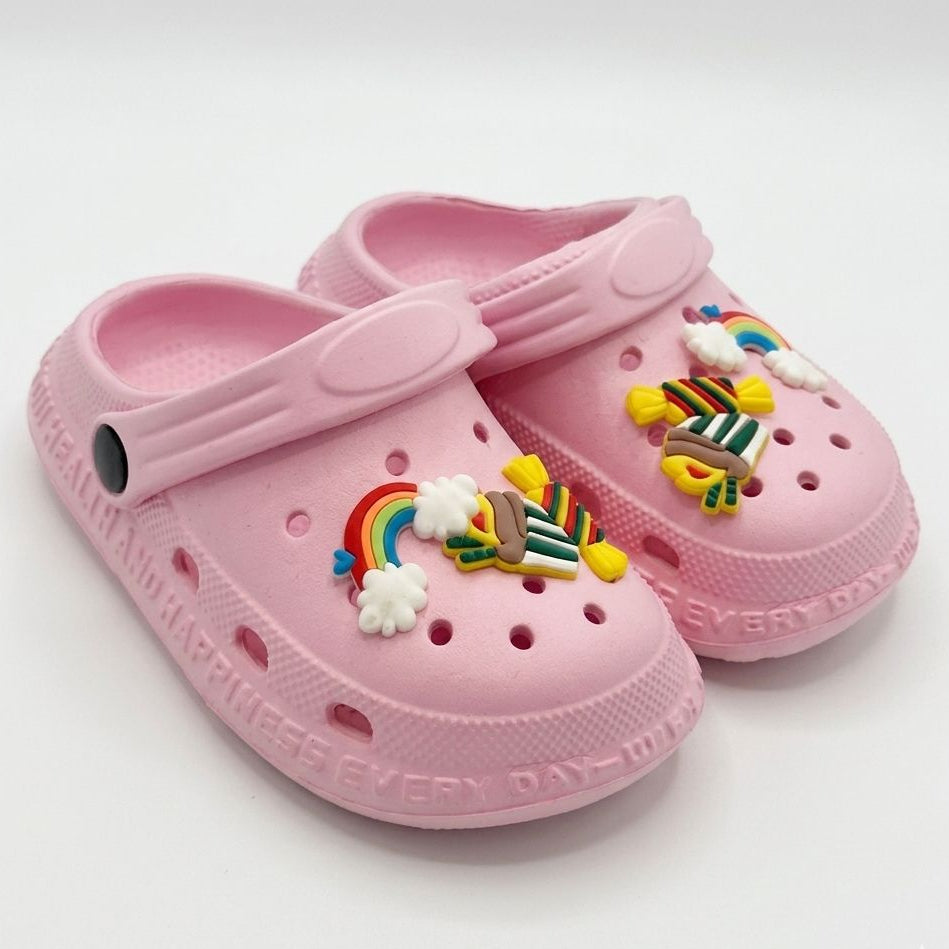 Pink children's clogs with colorful embellishments on a white background