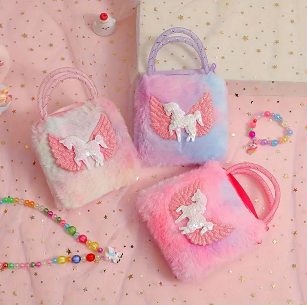 Set of three fluffy bags with unicorn designs on a pink background