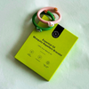 Mosquito repellant bracelet on a green packaging with brand logo