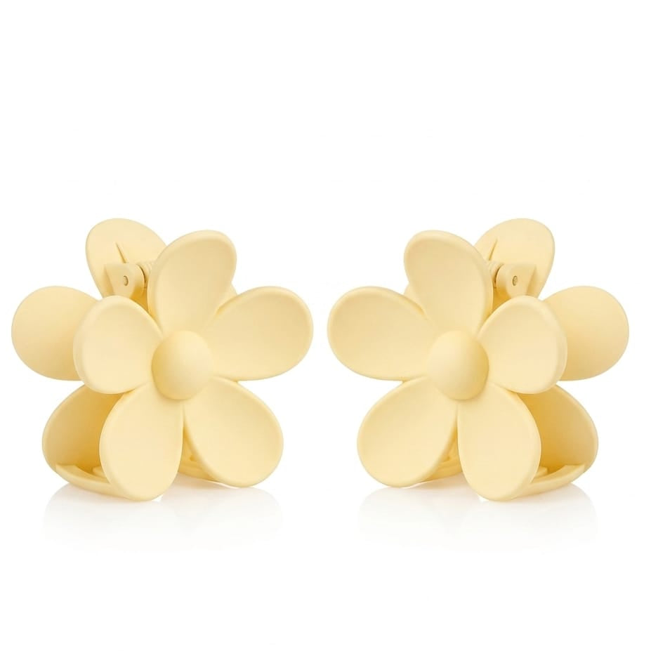 Gold flower-shaped earrings on a white background