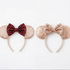 Two decorative headbands with bow details on a white background