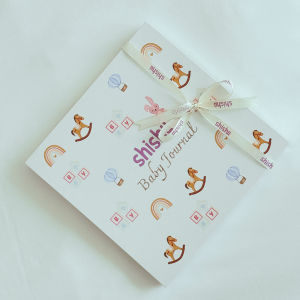 Baby journal with decorative elements on a light background