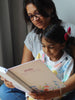 Mother reading the Mom Journal with her daughter 