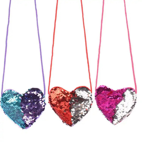 A set of three heart-shaped sequin purses in pink, red, and blue colors.