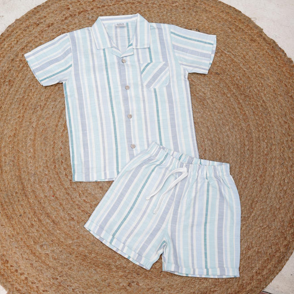 Striped shirt and shorts set on a woven mat