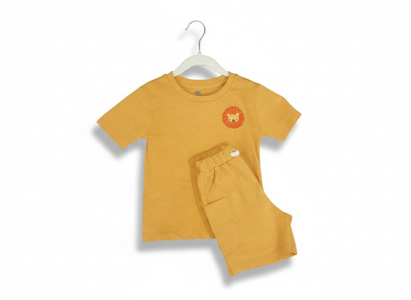 Yellow children's t-shirt and pants set on a white background