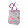 Tote bag with mermaid design and purple handles on a white background