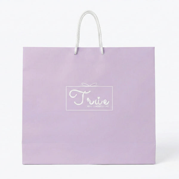 Purple gift bag with 'True' logo on a white background