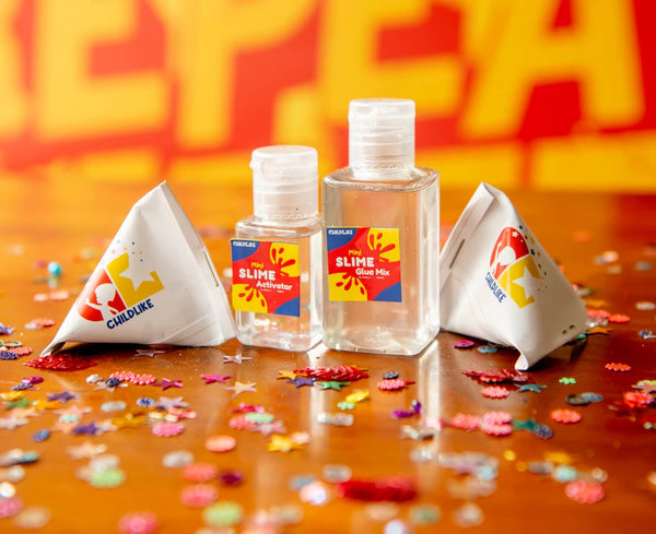 Two small bottles with colorful labels and two white triangular containers on a bright orange background with 'Cul du' branding.