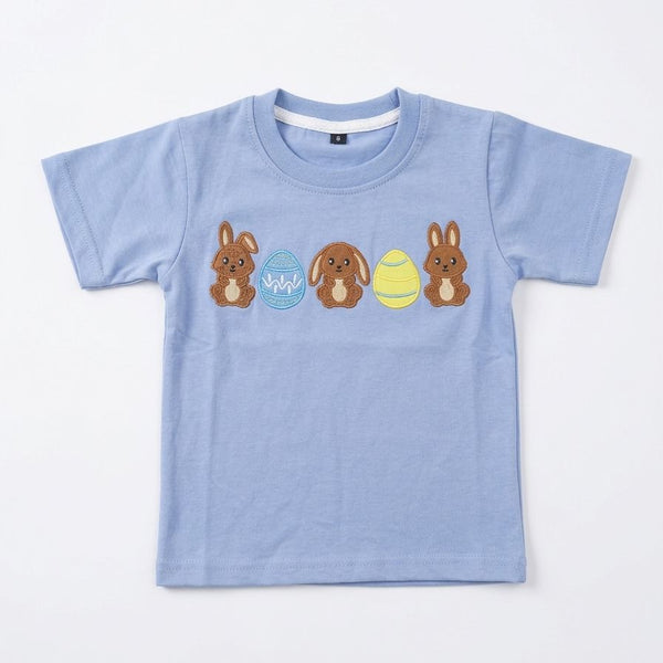 Light blue t-shirt with cartoon characters on a white background