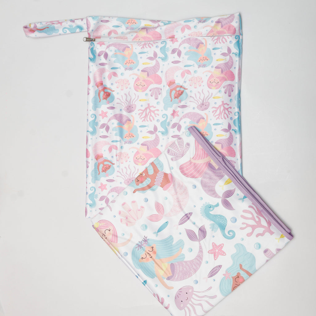 Mermaid-themed pouch and blanket set on a light gray background