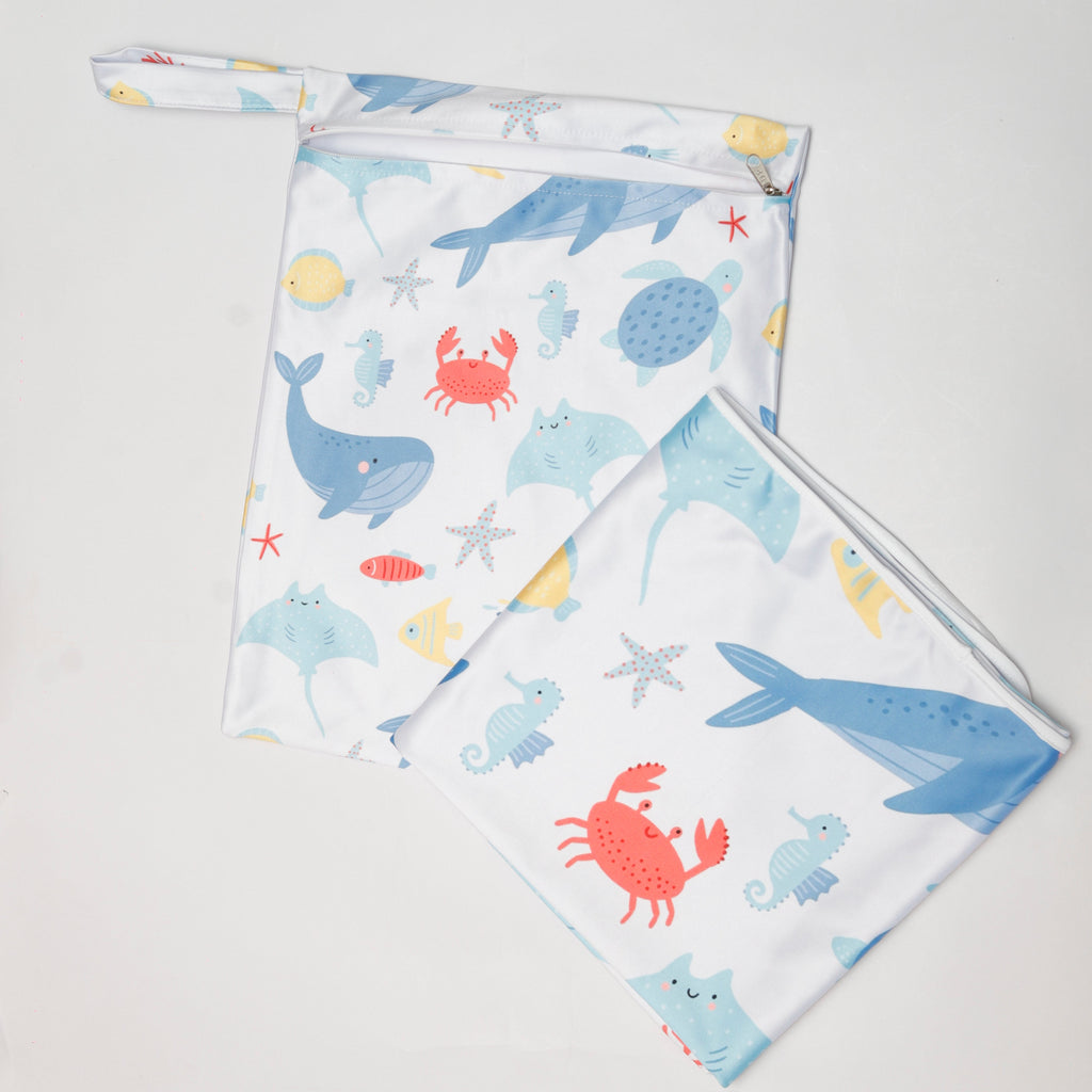 Two fabric swatches with ocean-themed designs on a light gray background