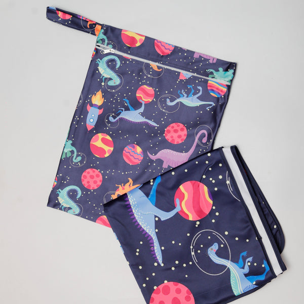 Two pairs of shorts with space-themed designs on a light gray background