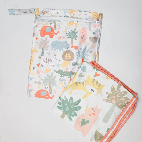Two baby blankets with animal and plant pattern on a light gray background
