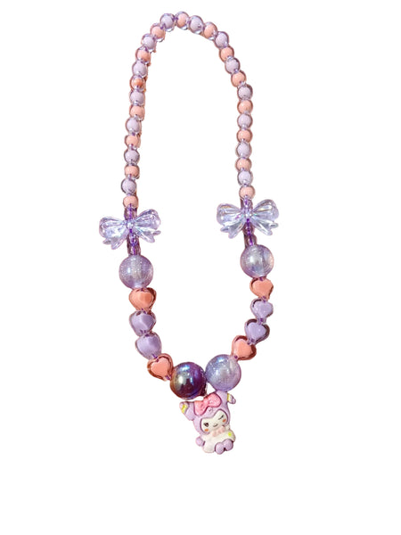 Pastel-colored beaded necklace with bow accents and a small plush toy on a white background