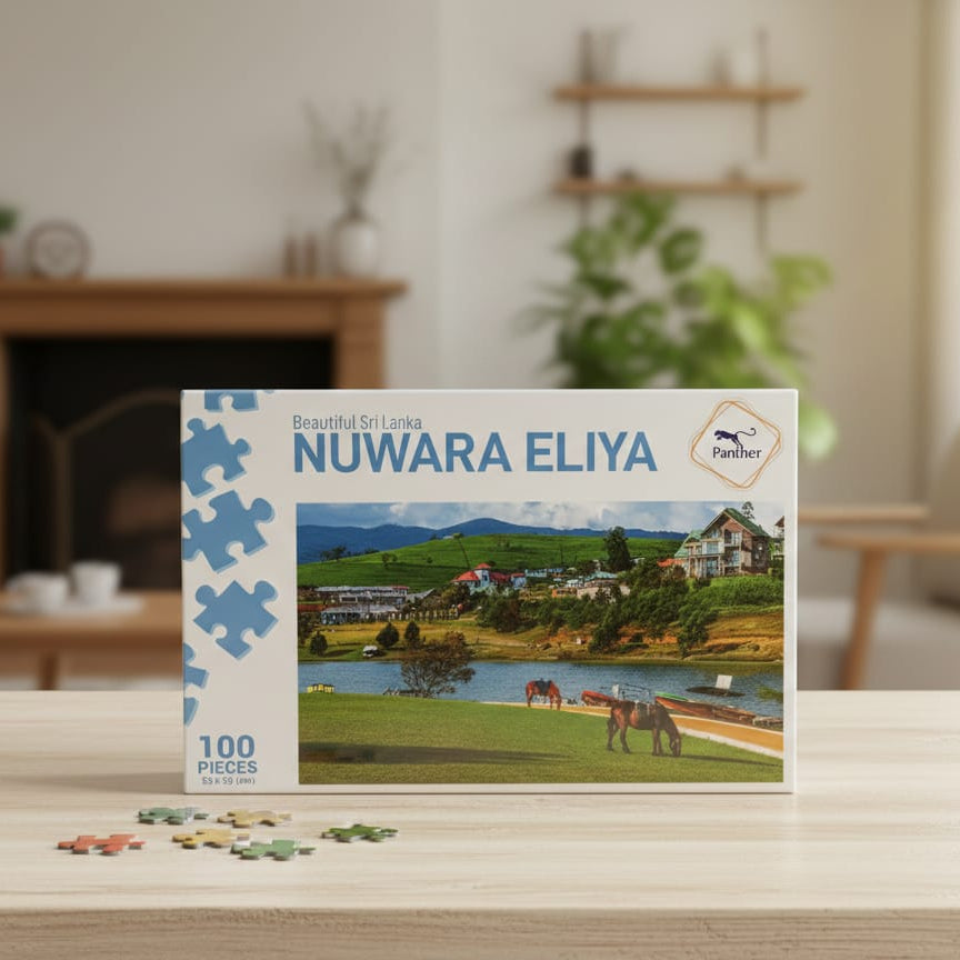 Jigsaw puzzle box featuring Nuwara Eliya with a scenic view on a wooden table.