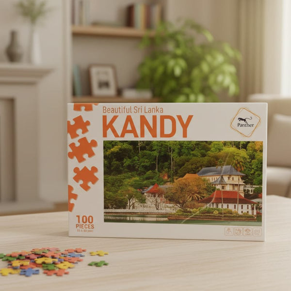 Jigsaw puzzle box featuring Kandy, Sri Lanka on a table in a living room.