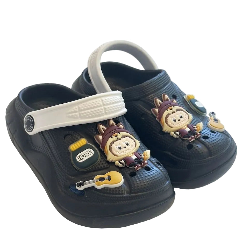 Black clogs with cartoon character embellishments on a white background