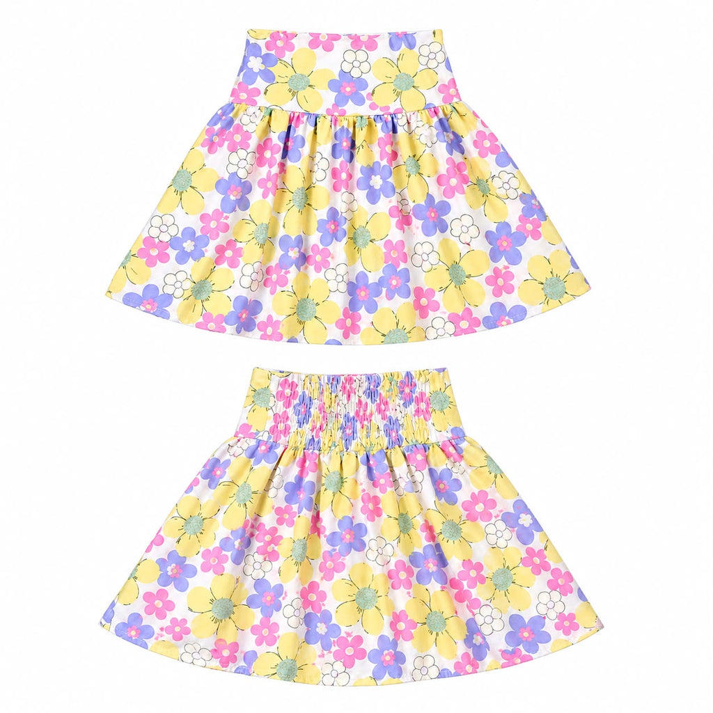 Two matching girls' floral skater skirts shown flat against a white background, one for each size, featuring a yellow base with pink, purple, blue, and green flowers.