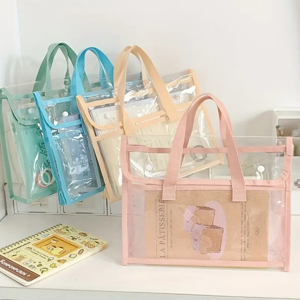 Set of clear bags with handles on a white surface
