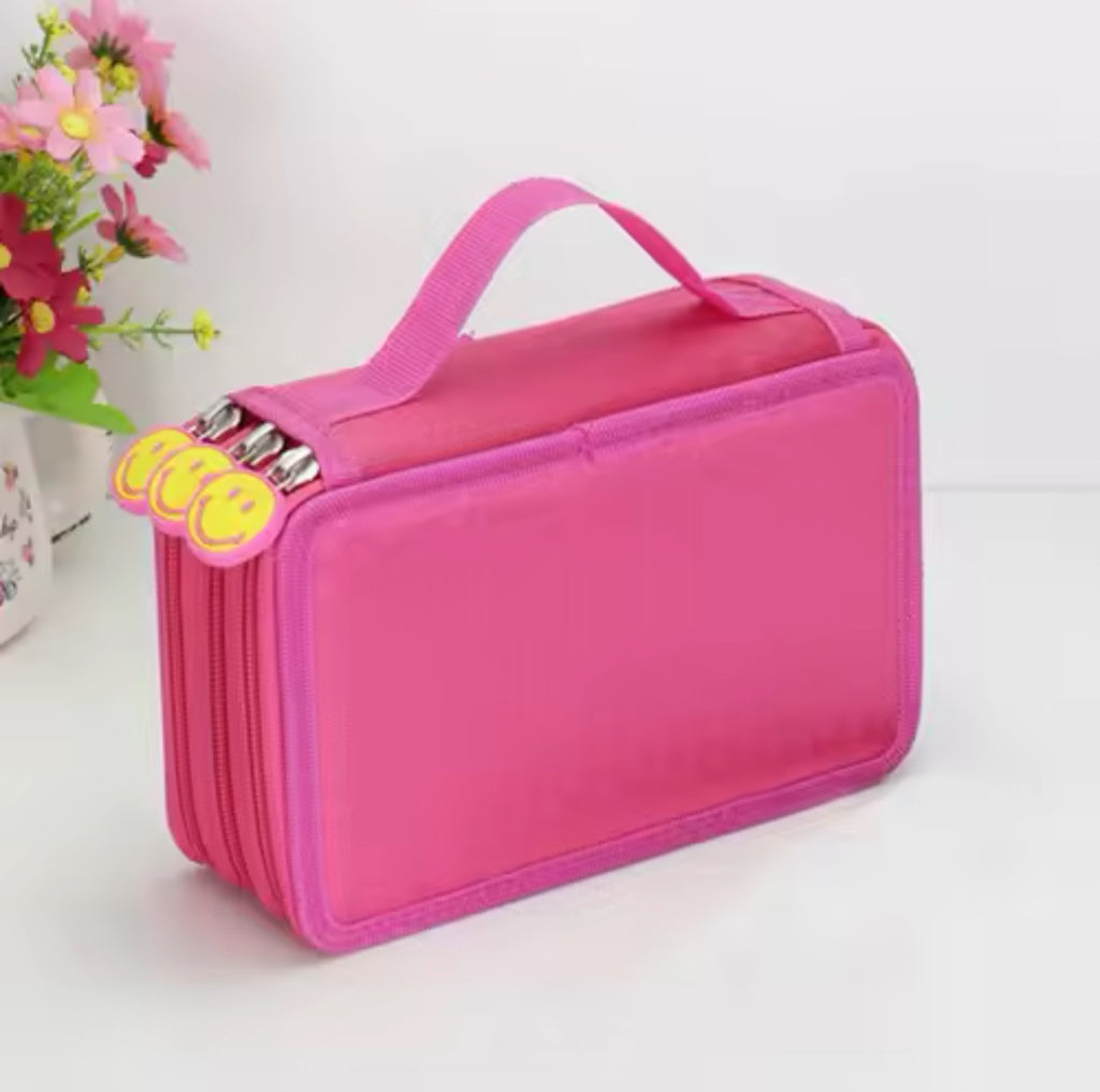 A deep pink pencil case with a zipper, placed on a surface with a handle and tags visible, potentially indicating customization options.
