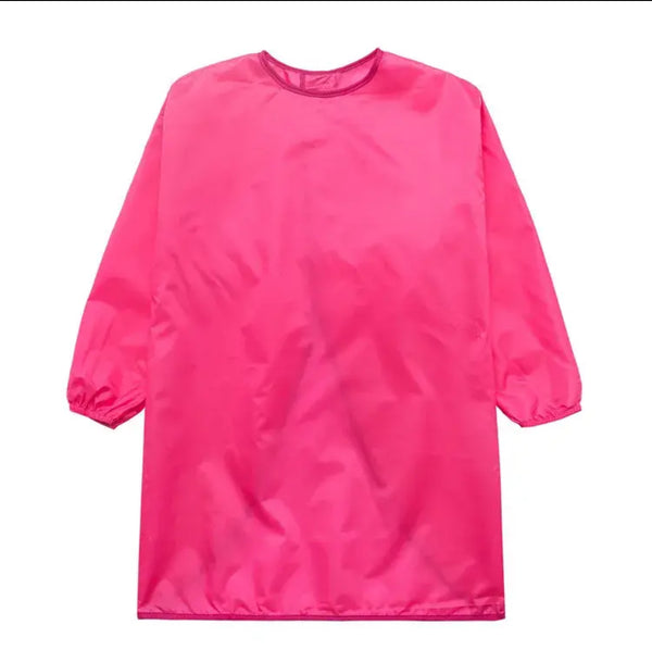 A long sleeve apron in deep pink color, designed for children.