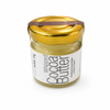 Jar of whipped cocoa butter with a gold lid on a white background