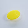 Yellow silicone bath and massage brush with a suction cup base, designed for exfoliating skin and massaging scalps, shown on a white background.