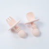 Anti-choke silicone starter cutlery in pastel pink with a wide silicone placement for the safety purpose of the toddlers.