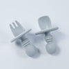 Anti-choke silicone starter cutlery in light grey with a wide silicone placement for the safety purpose of the toddlers.