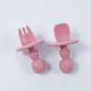 Anti-choke silicone starter cutlery in rosy mauve with a wide silicone placement for the safety purpose of the toddlers.