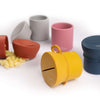 True silicone snack lid with cup in seven range of colors, BPA Free. The lid has a sliced opening in the middle.
