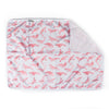 A folded pink waterproof changing mat with a pattern of pink and gray flamingos, displayed on a white background.