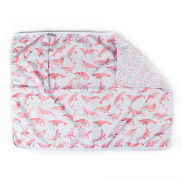 A folded pink waterproof changing mat with a pattern of pink and gray flamingos, displayed on a white background.